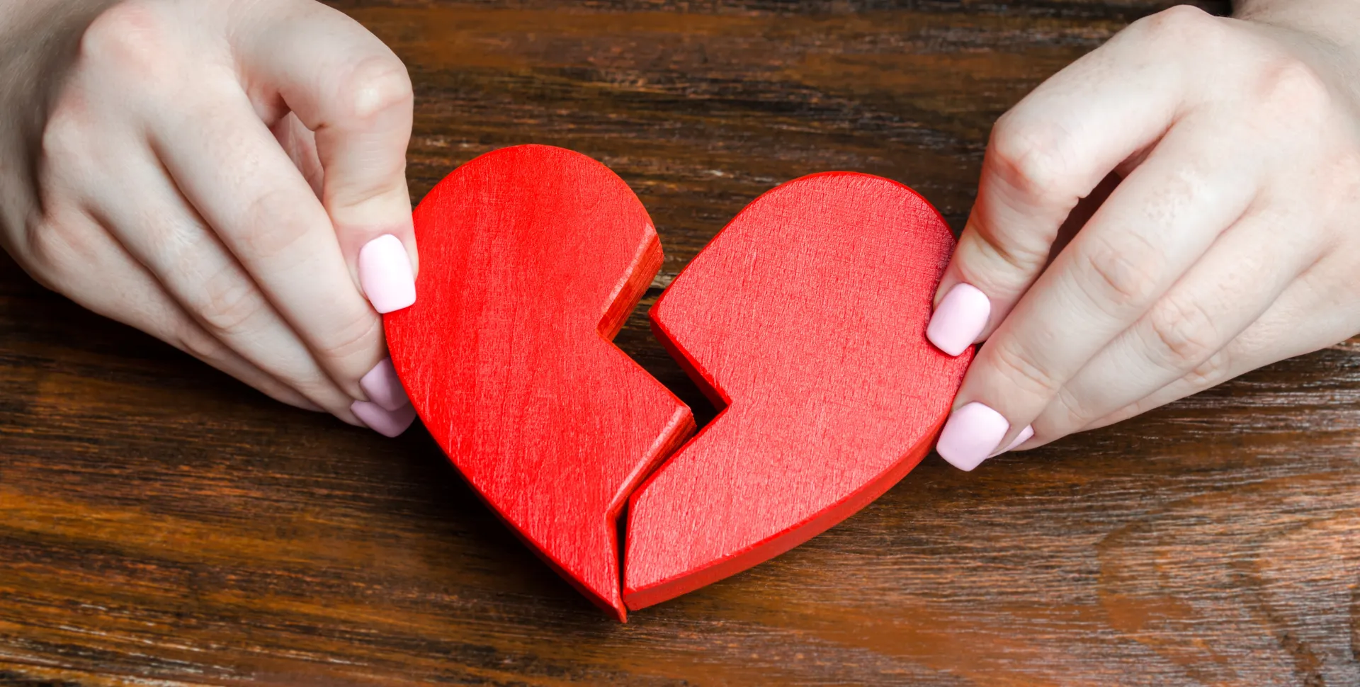 a-woman-collects-a-broken-heart-in-his-hands-2023-11-27-05-26-19-utc